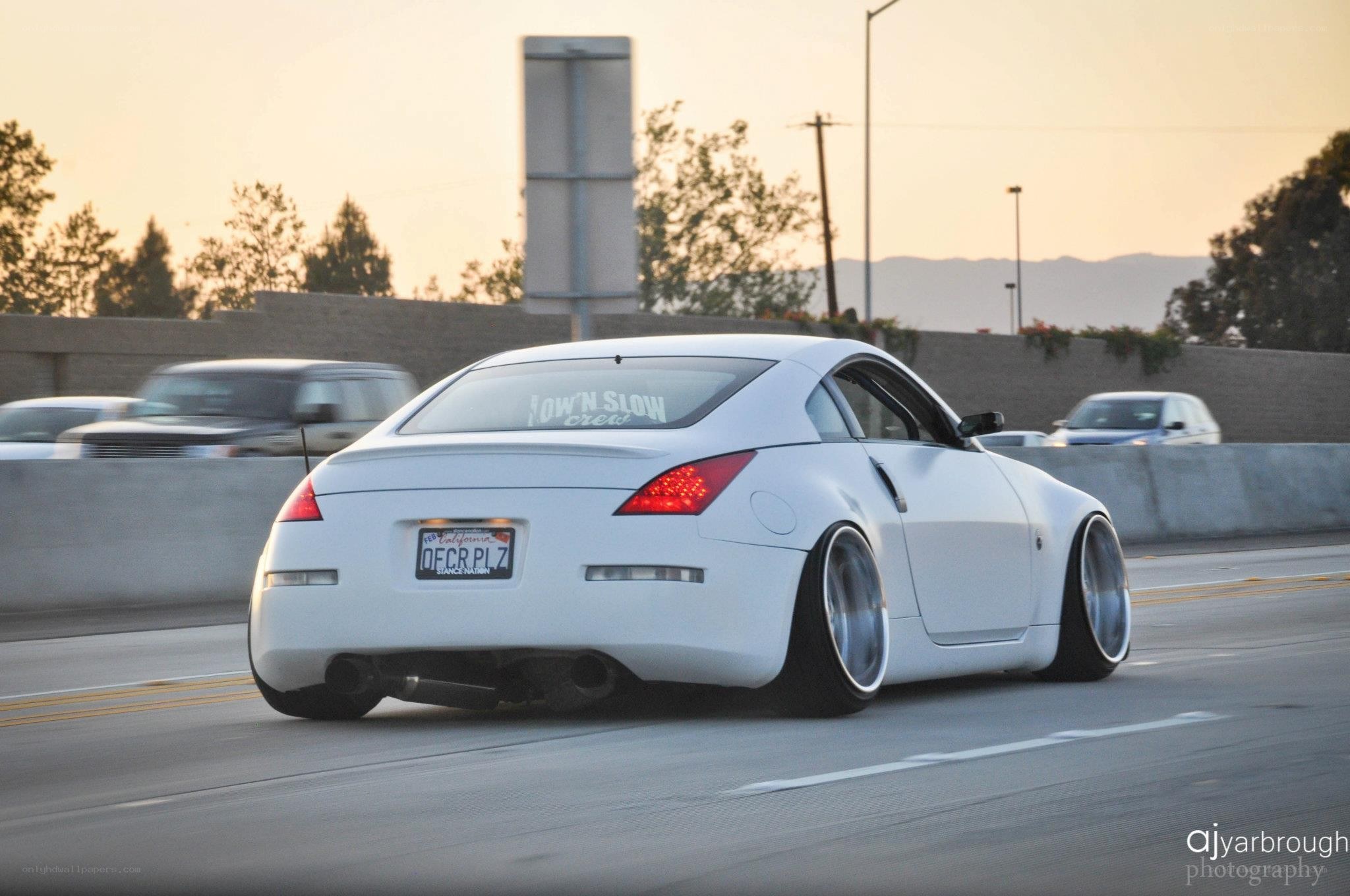 white coupe on highway