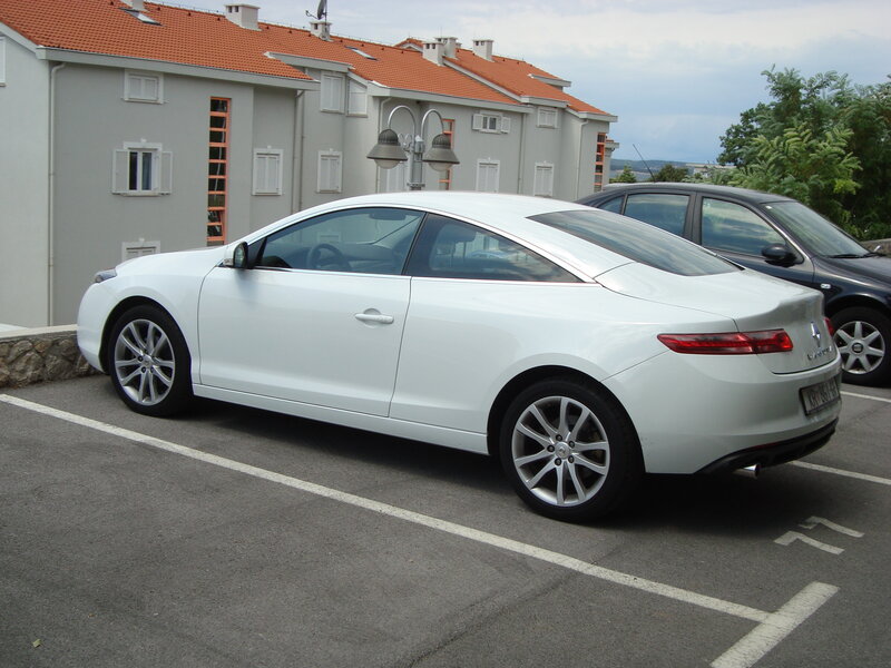 White coupe parked in lot
