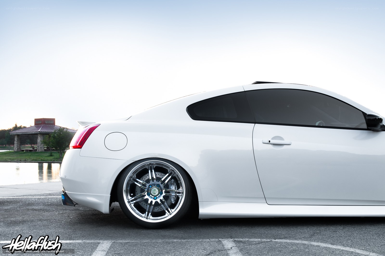 white coupe with custom wheels