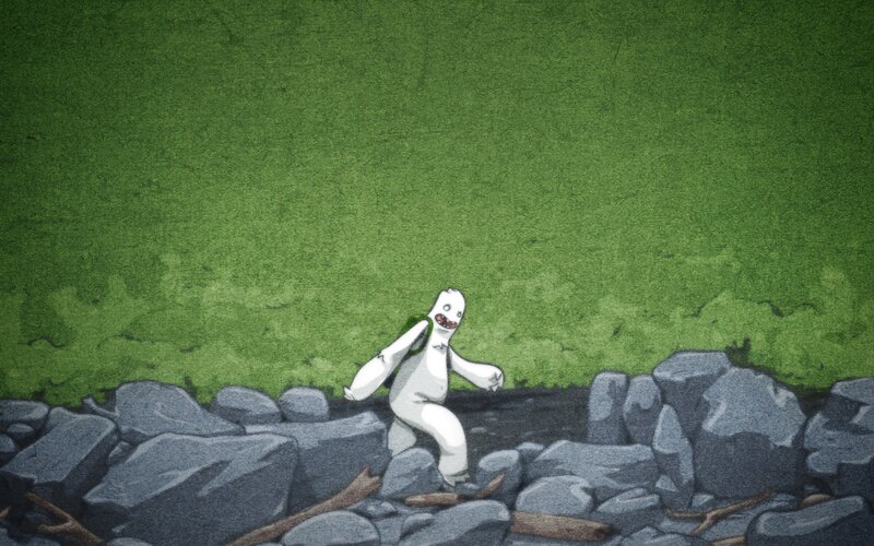 white creature on rocky ground