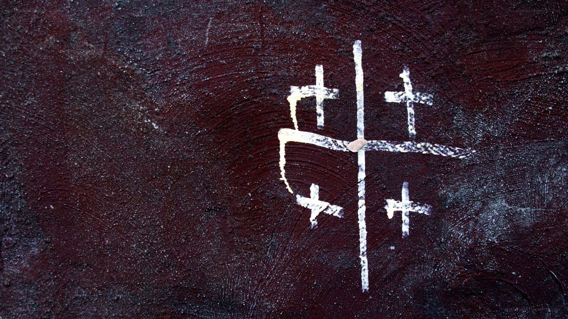 white crosses on dark wall
