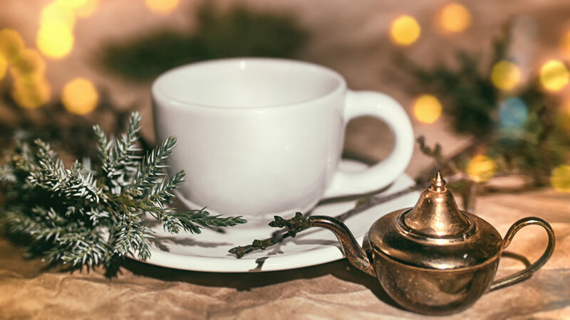 White Cup and Brass Teapot