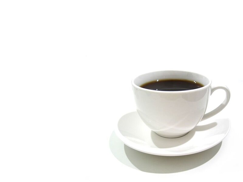 white cup of black coffee