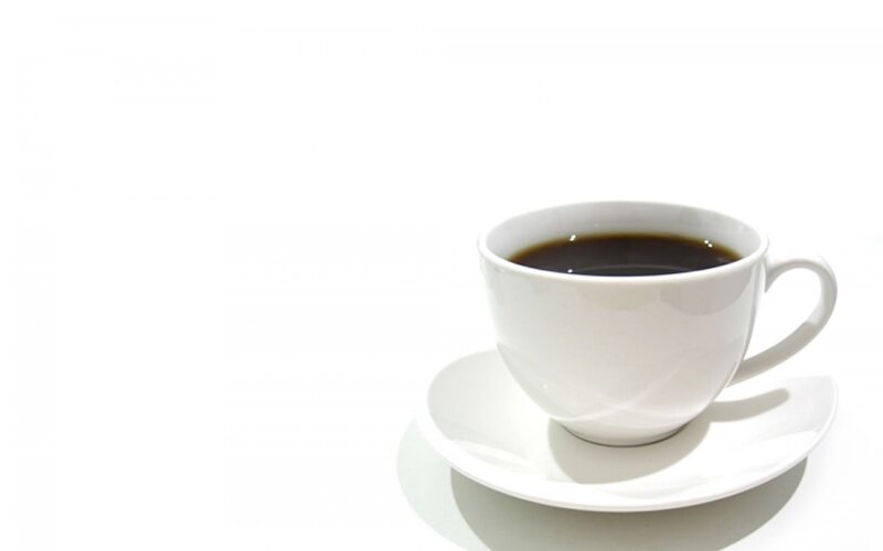 white cup of black coffee