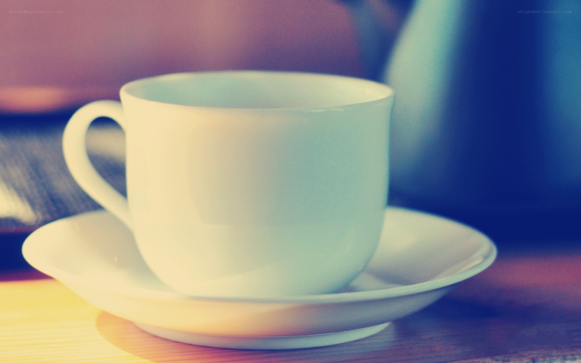 white cup on saucer