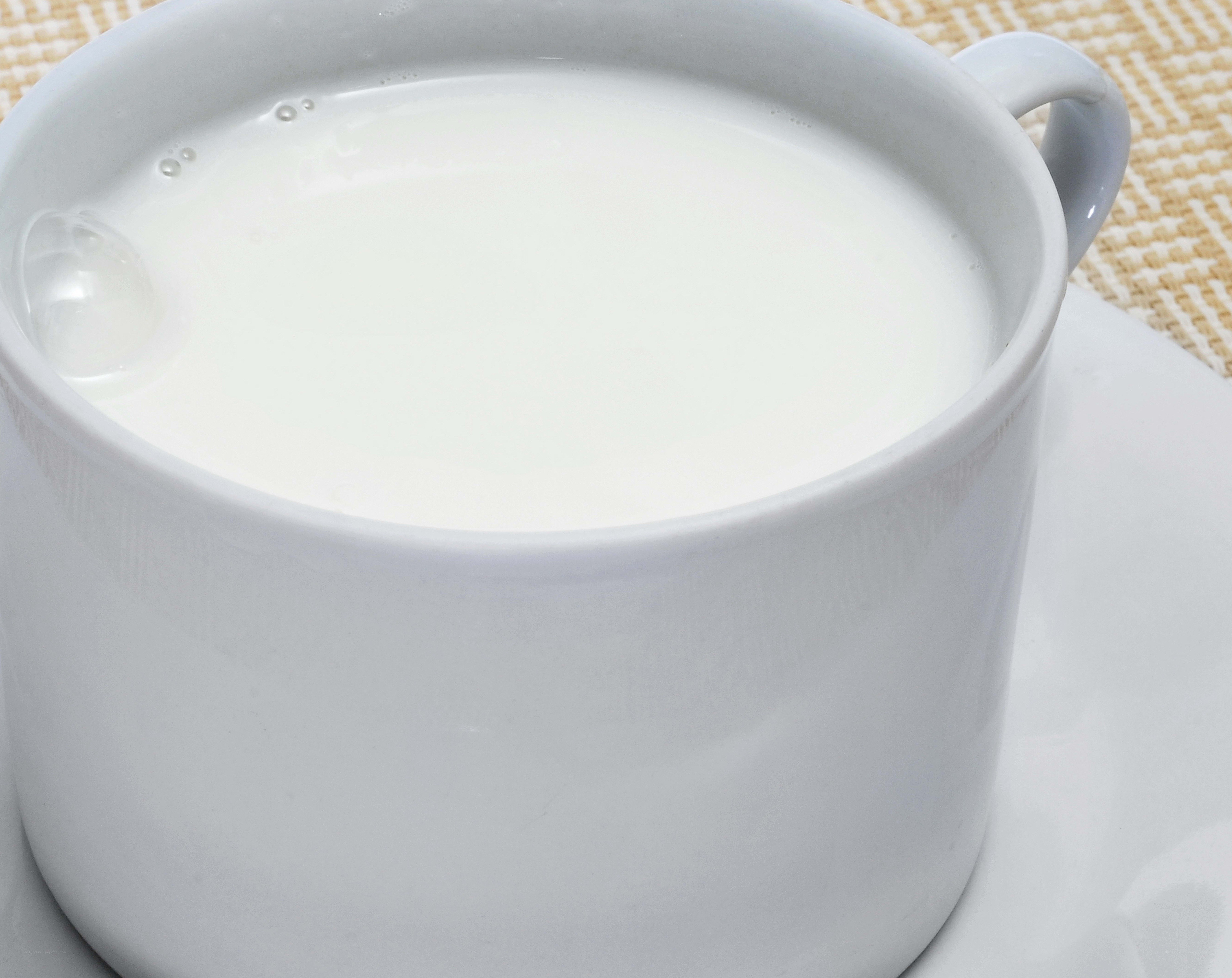 white cup with milk