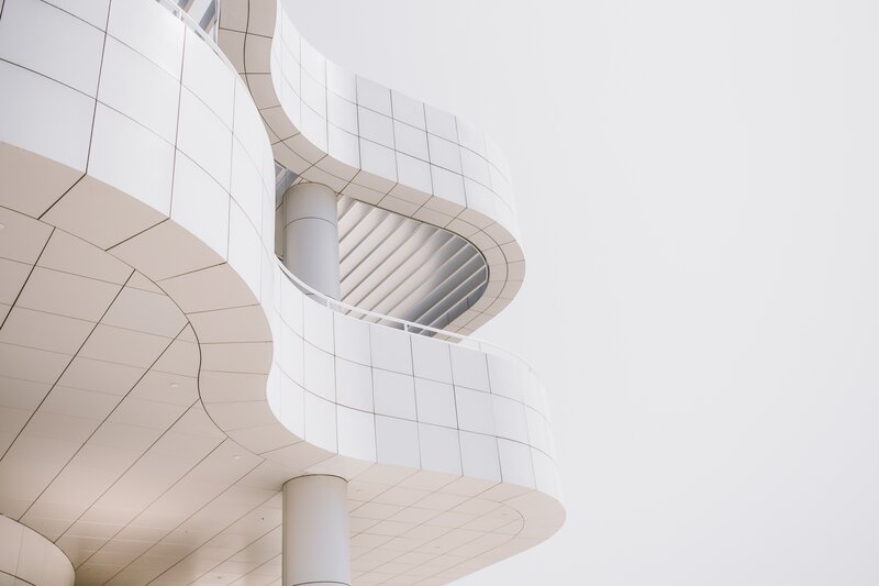 White Curved Building — Minimalist