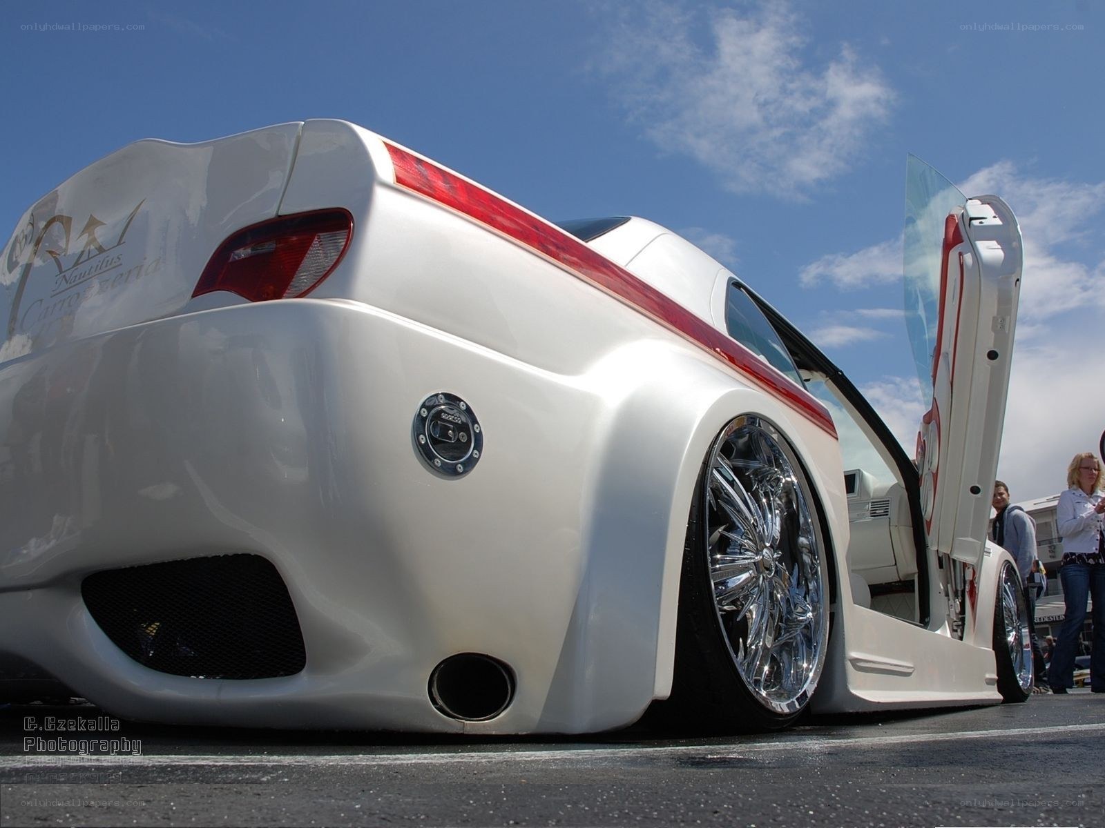 white custom car with gullwing door