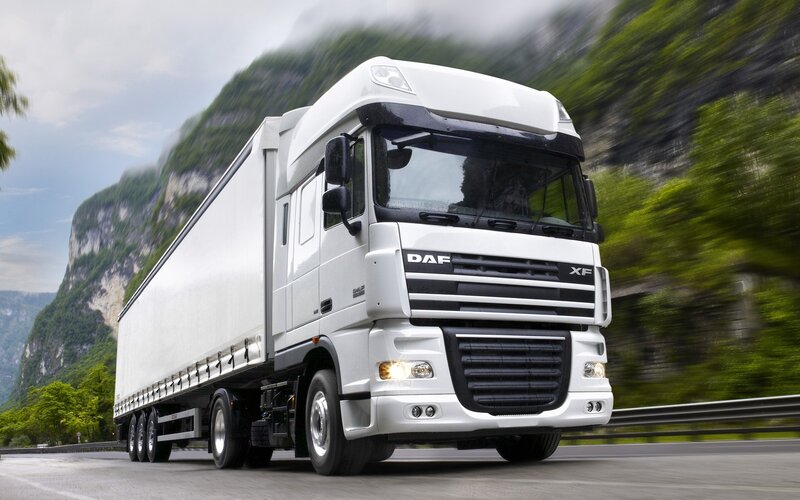 White DAF XF truck on mountain road