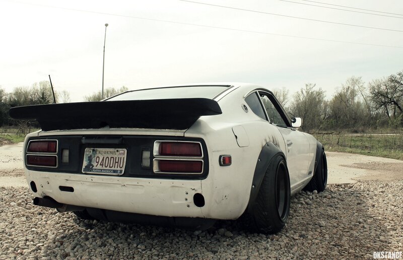 white datsun with rear spoiler