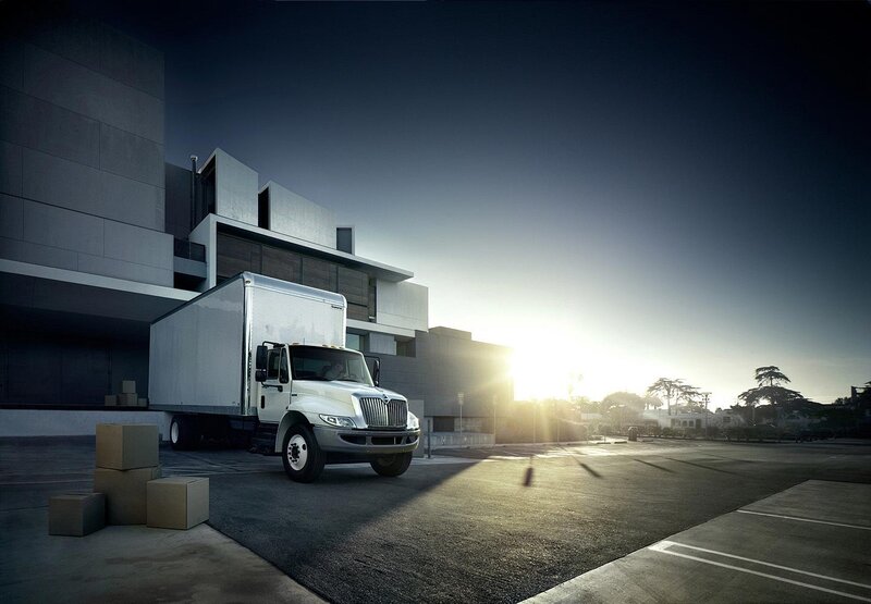 White delivery truck at modern building
