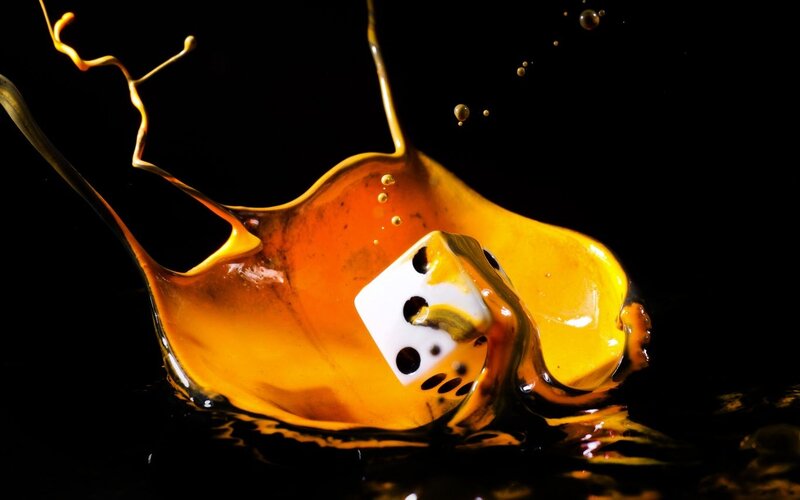 White Die in Liquid Splash