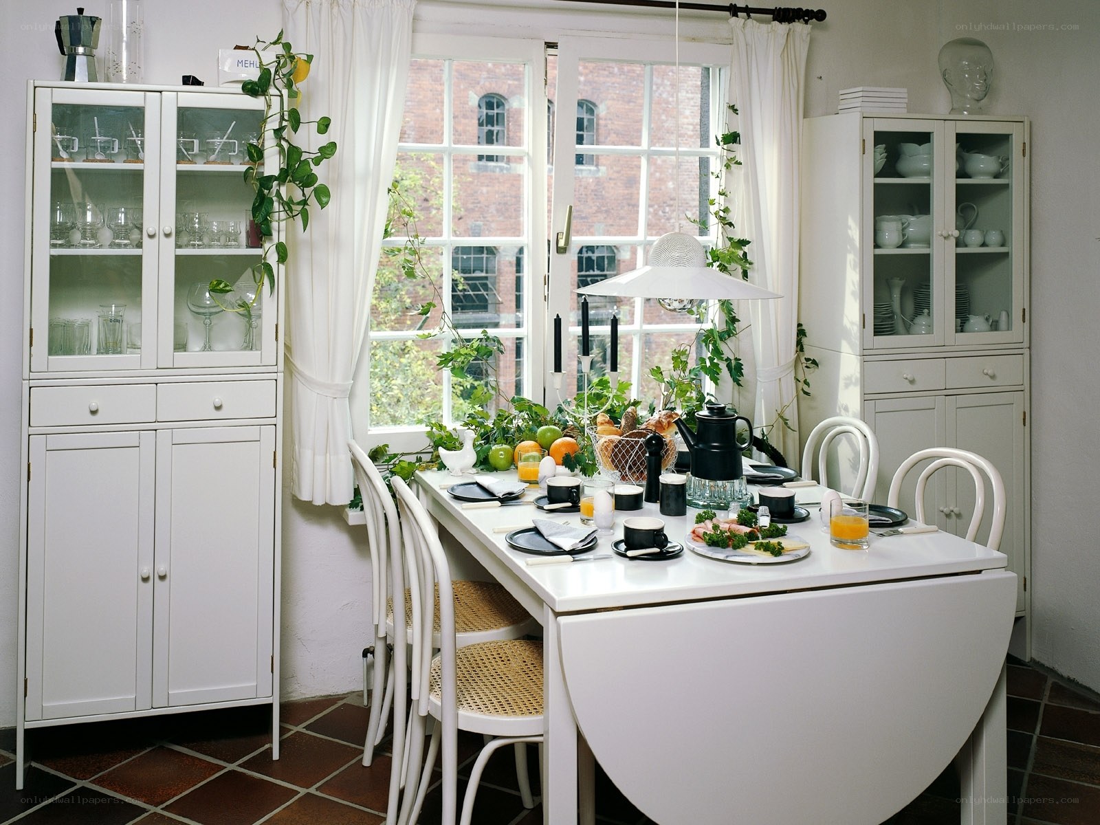 White dining room with glass cabinets