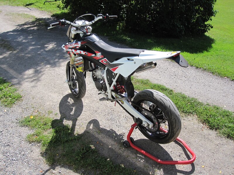white dirt bike on stand