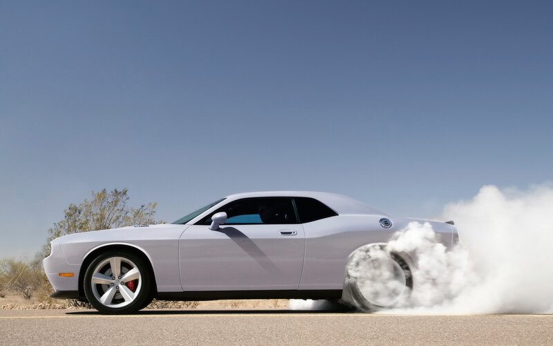 white dodge challenger burnout