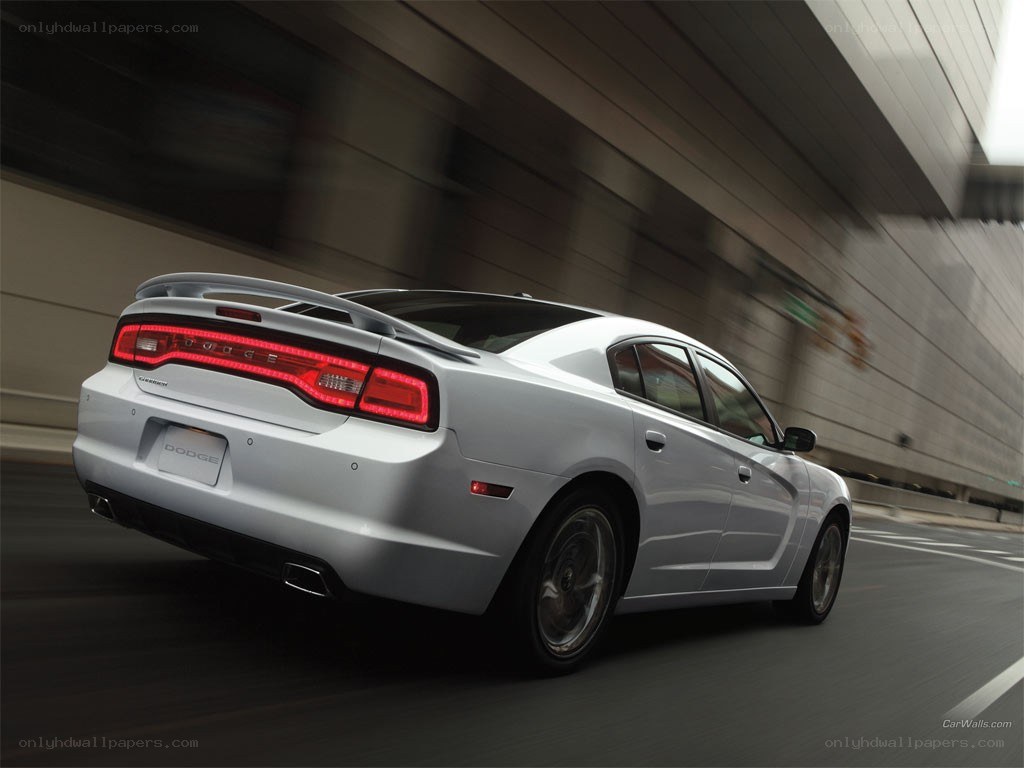 White Dodge Charger in motion