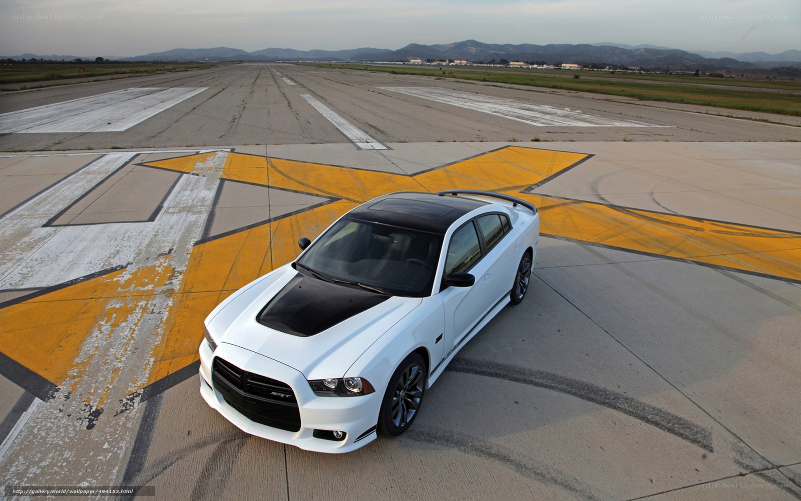 White Dodge Charger on airfield