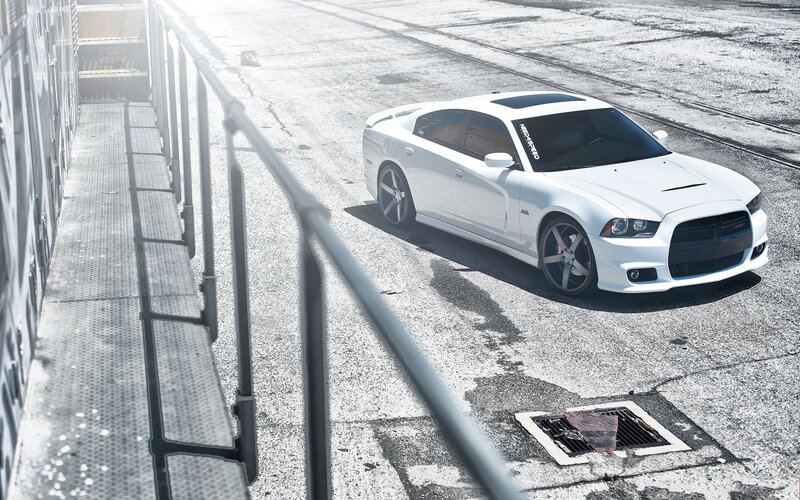 white dodge charger on concrete