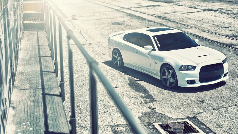 white dodge charger on concrete