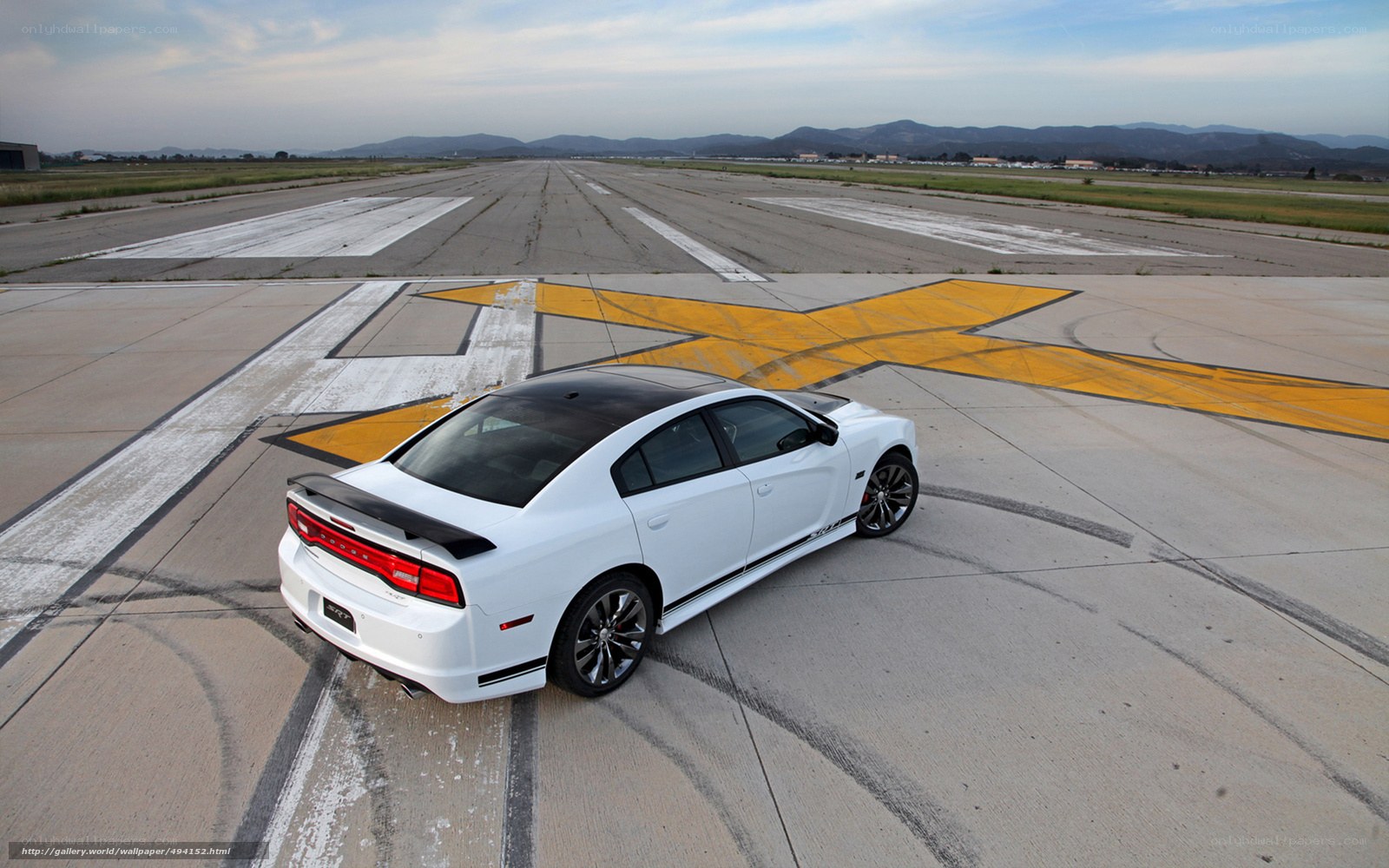 White Dodge Charger on runway