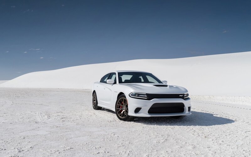 White Dodge Charger SRT on sand dunes