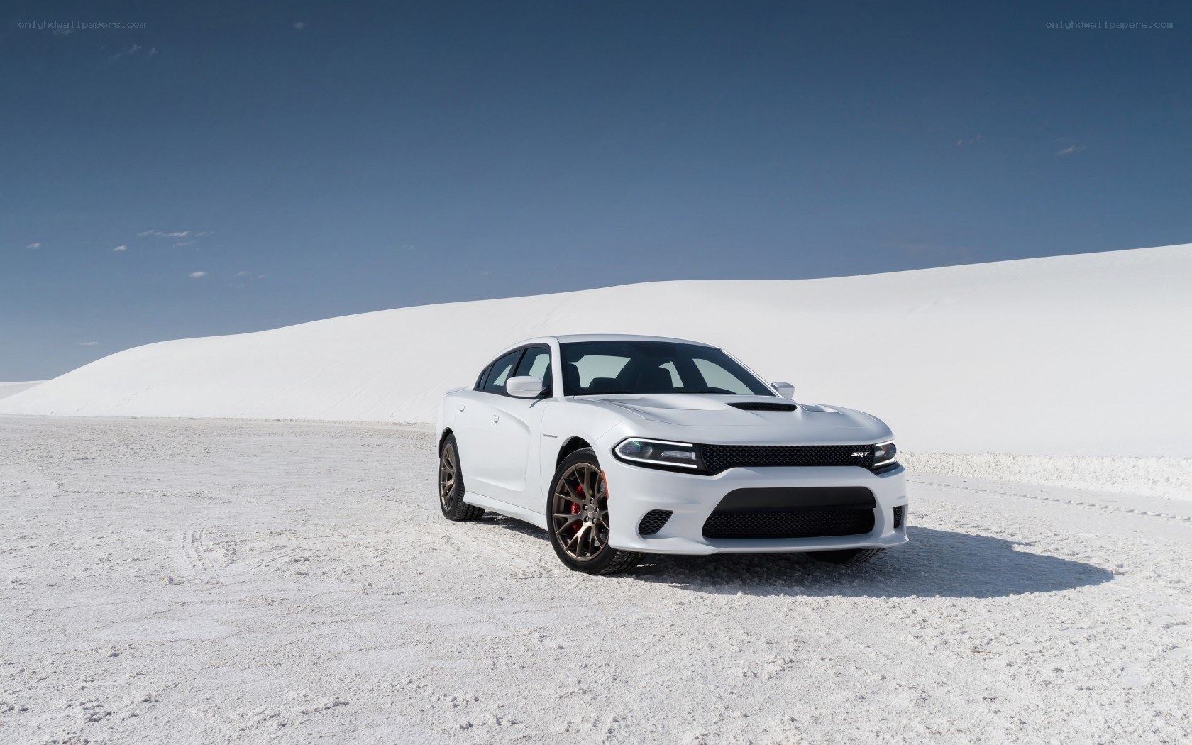 White Dodge Charger SRT on sand dunes