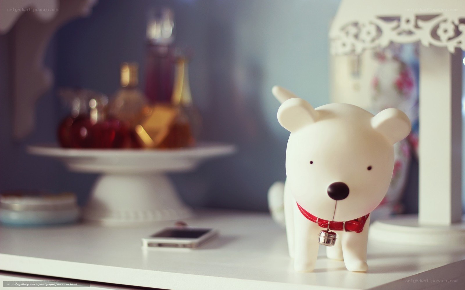 white dog figurine on table