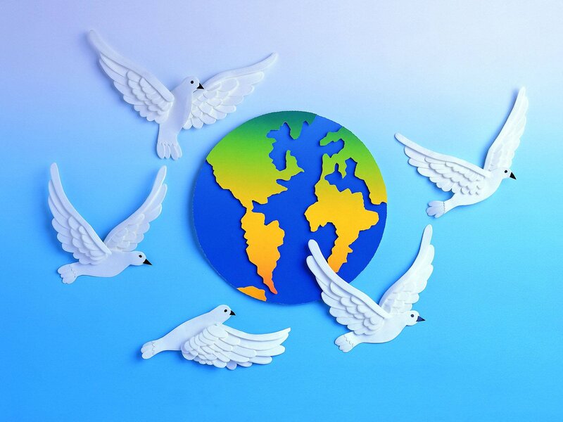 White Doves Around Globe