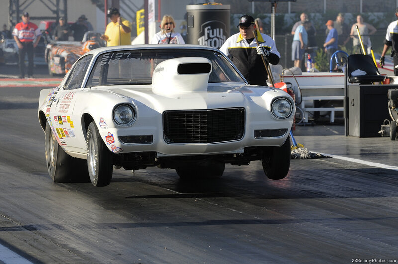 white drag racing car on track