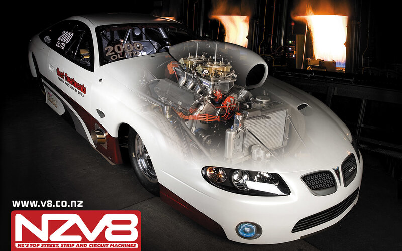 White drag racing car with engine