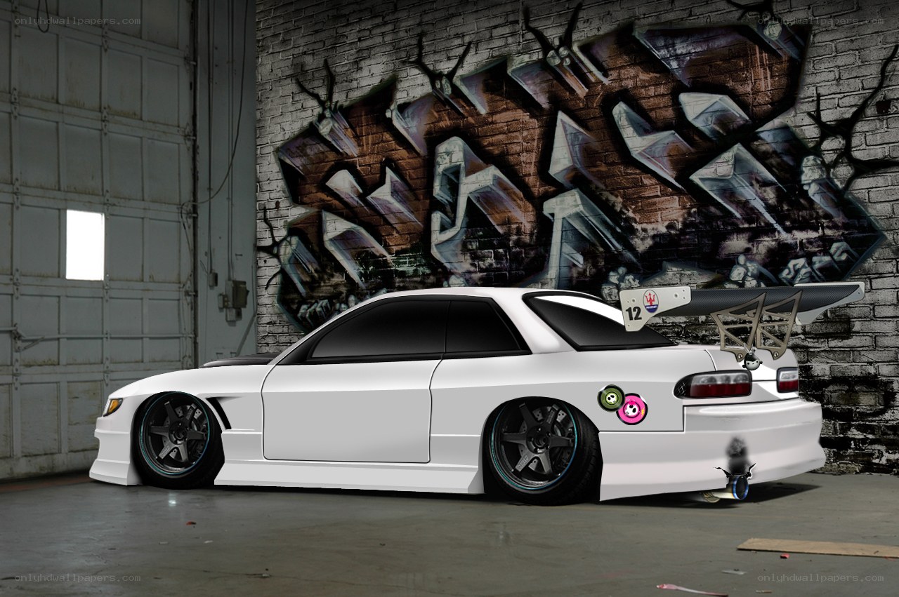 white drift car in garage
