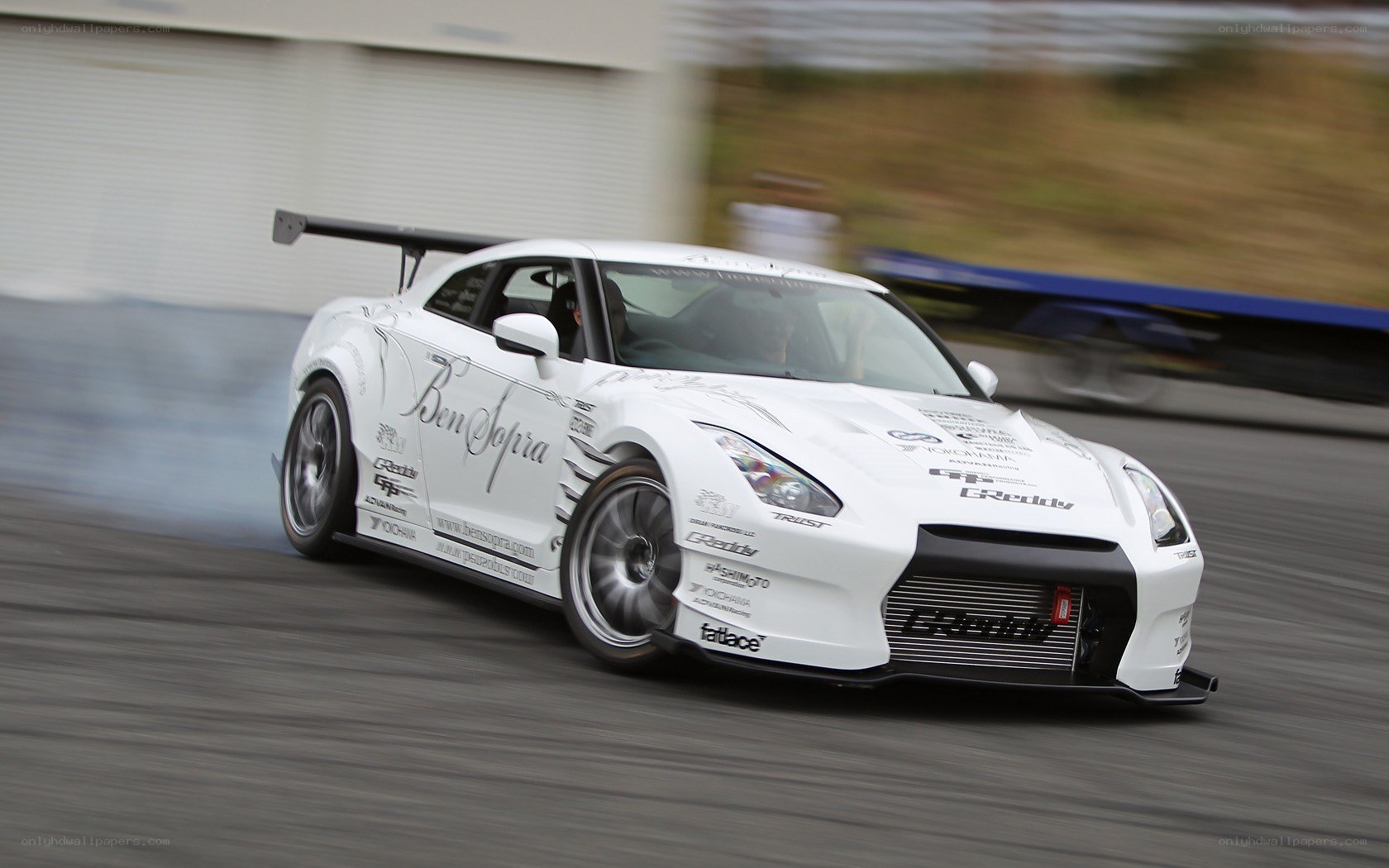 white drift car in motion
