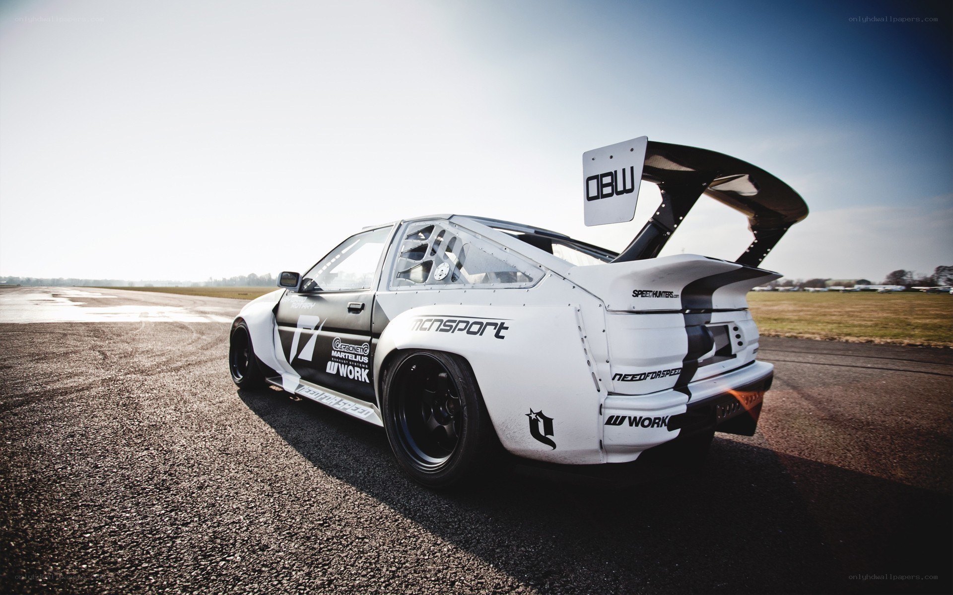white drift car on track