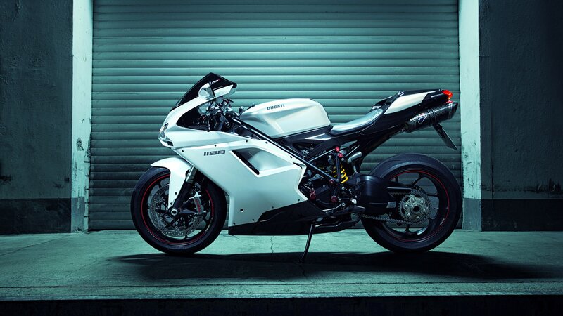 White Ducati Motorcycle — Dramatic, Photograph, Garage Door