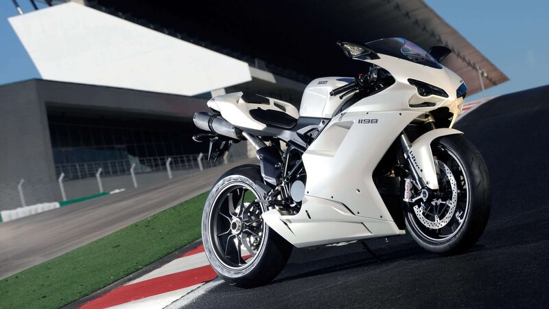 White Ducati sportbike on racetrack