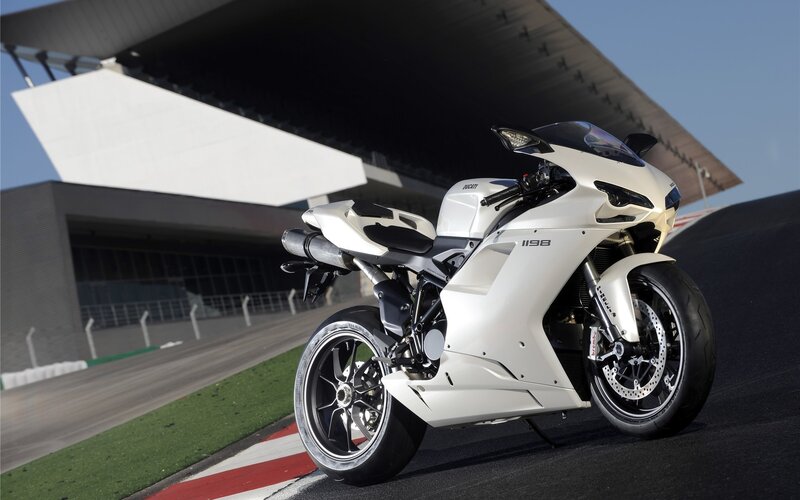 White Ducati sportbike on racetrack