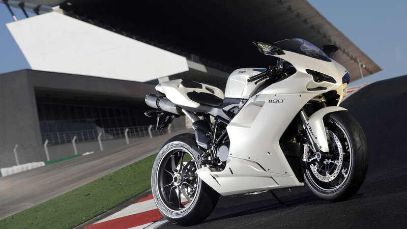 White Ducati sportbike on racetrack
