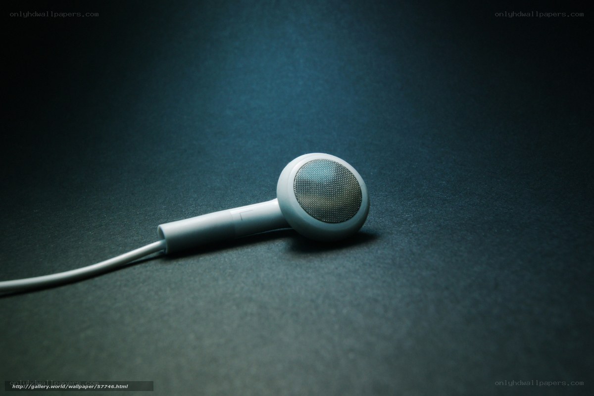 white earbud on dark surface