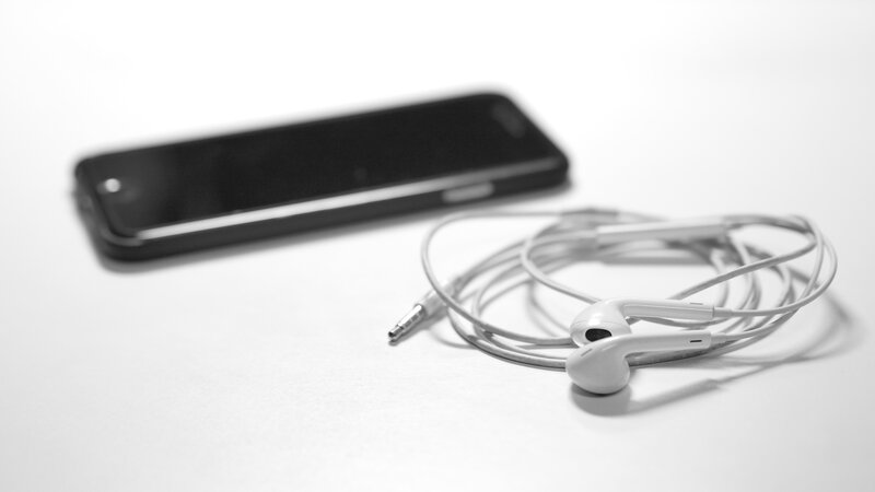 White Earbuds and Phone