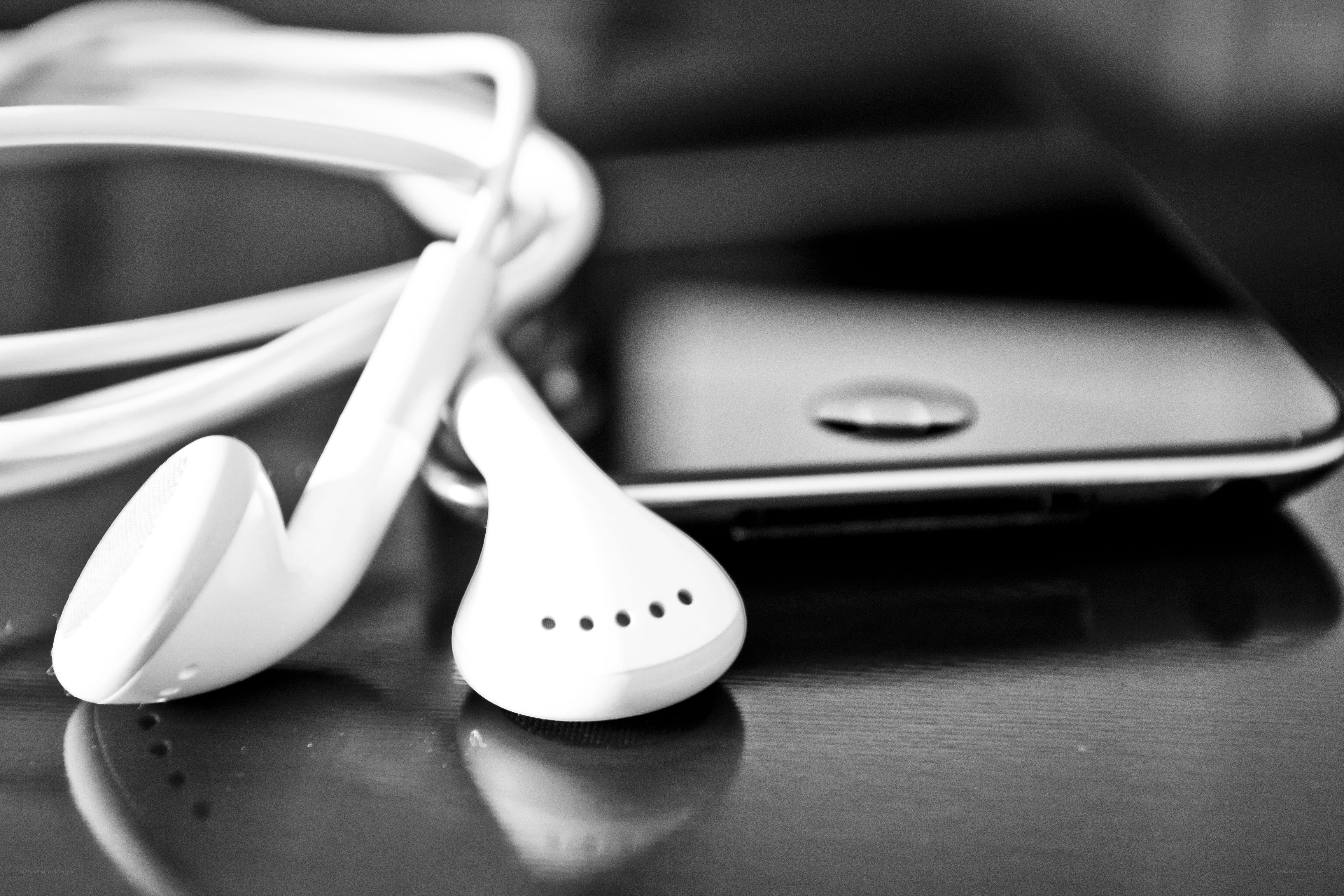 White earbuds and smartphone