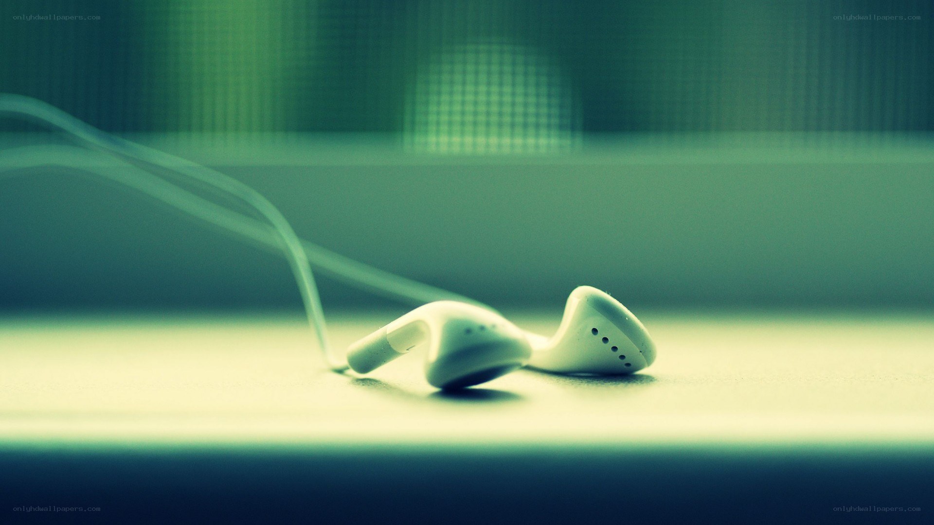 white earbuds on a surface