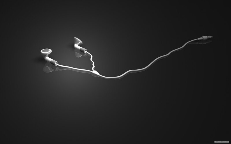 white earbuds on dark background