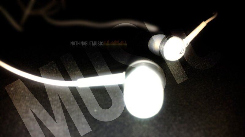 white earbuds on dark surface