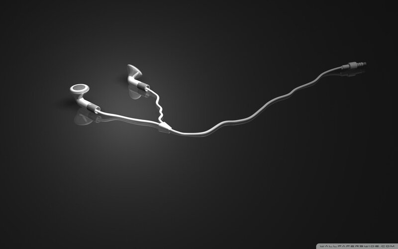 White Earbuds on Dark Surface — Black