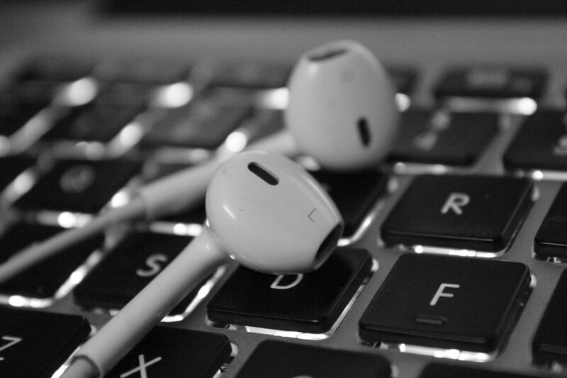 White Earbuds on Keyboard