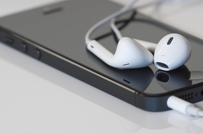 White Earbuds on Phone