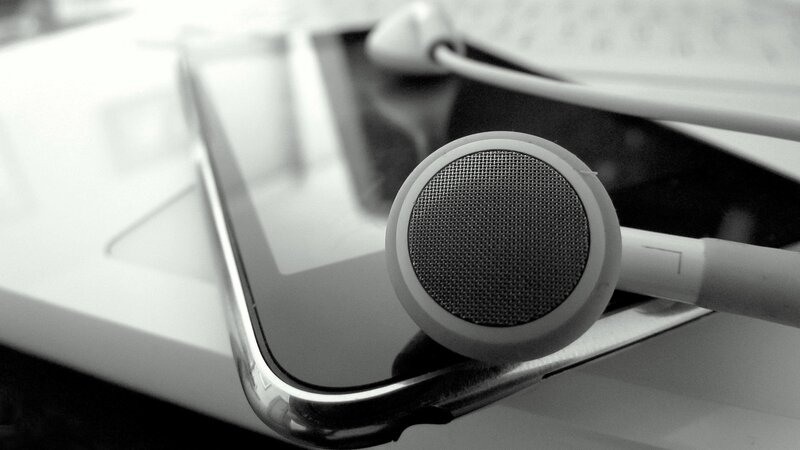 White Earbuds on Tablet — Black, Minimalist