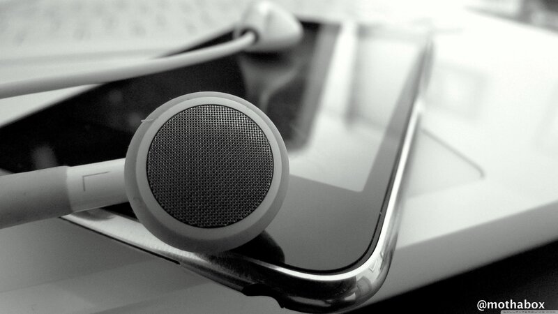 White Earbuds on Tablet