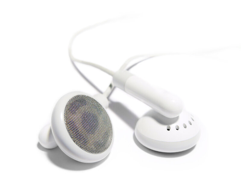 white earbuds on white background