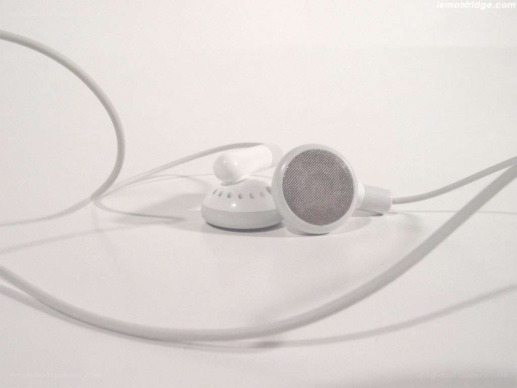white earbuds on white surface